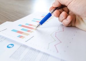 marketer analysing financial charts